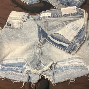 Light colored jean shorts.